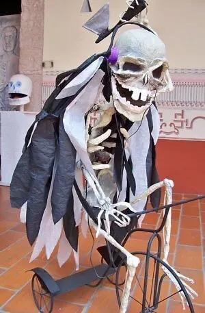 Life-sized skeleton riding a bike at the National Museum of Death in Mexico