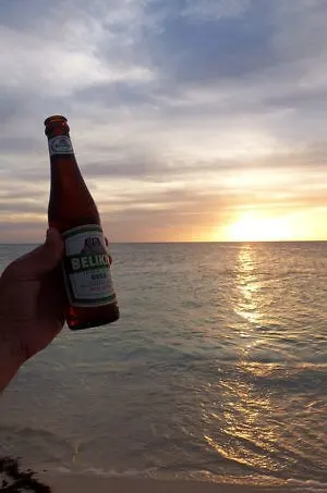 Belikin beer and another glorious sunset in Belize, on Glover's Atoll