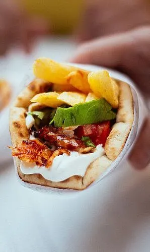 A stuffed pita bread meal on the streets of Athens, Greece