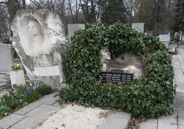 gravestone surrounded by vines