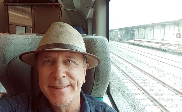 Tim Leffel working on a review on the Maya Train through the Yucatan Peninsula